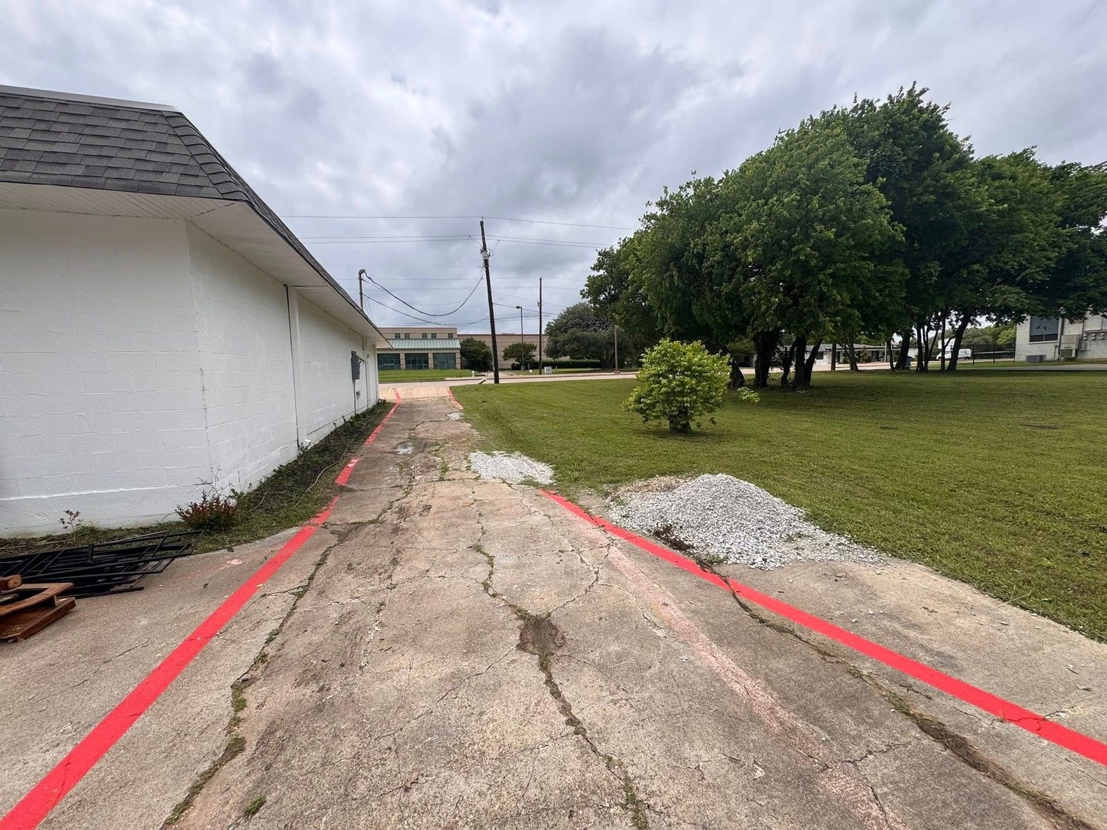 Freshly painted red fire lane striping at a commercial building